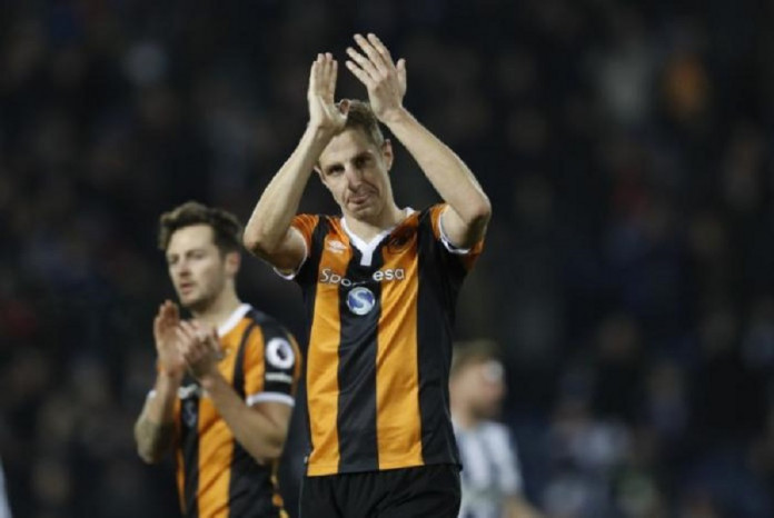 Hull City's Michael Dawson applauds fans after the game