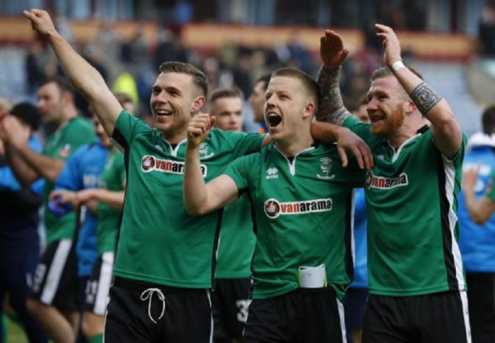 Lincoln's Alan Power, Terry Hawkridge and Jonathan Jack Muldoon celebrate after the match Lincoln's Alan Power, Terry Hawkridge and Jonathan Jack Muldoon celebrate after the match