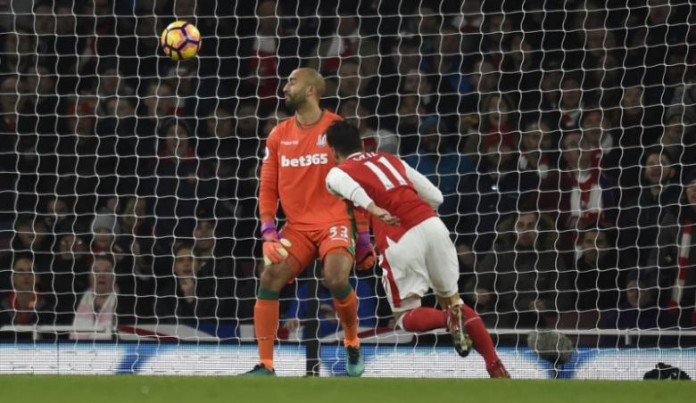Arsenal's Mesut Ozil scores their second goal Arsenal go top, Vardy hat-trick lights up Leicester