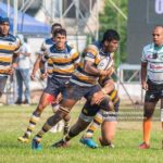 Ashel Ranasinghe of St. Peter’s College Rugby in action as referee Priya Suranga looks on