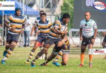 Ashel Ranasinghe of St. Peter’s College Rugby in action as referee Priya Suranga looks on