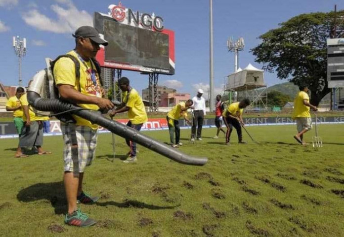 Ground staff use a blower to dry the field during the 4th Test between India-West Indies.