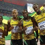 Jamaica's team Nesta Carter, Asafa Powell, Nickel Ashmeade and Usain Bolt pose for photographers after winning the men's 4 x 100 metres relay final during the 15th IAAF World Championships at the National Stadium in Beijing