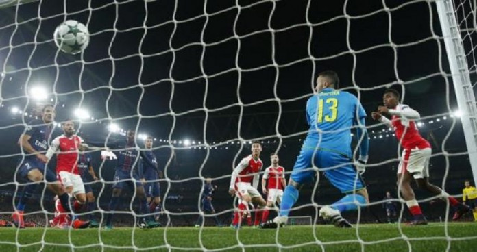 Arsenal's Alex Iwobi scores an own goal and the second goal for Paris Saint-Germain