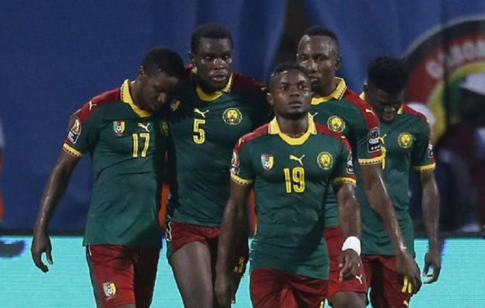 Cameroon's Michael Ngadeu-Ngadjui celebrates scoring their first goal with teammates