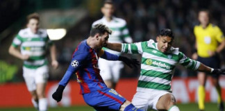 Barcelona's Lionel Messi in action with Celtic's Emilio Izaguirre