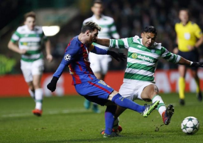 Barcelona's Lionel Messi in action with Celtic's Emilio Izaguirre