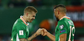 Republic of Ireland's James McClean celebrates after the game with Jonathan Walters