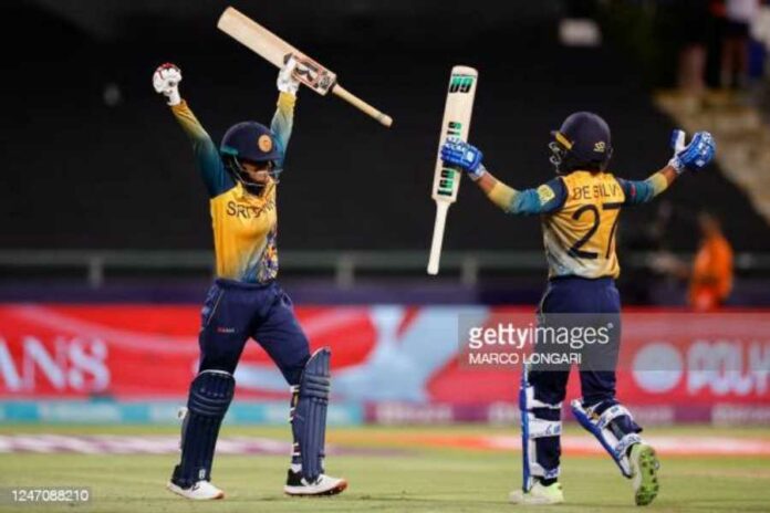 Sri Lanka's Harshitha Samarawickrama (L) and Sri Lanka's Nilakshi De Silva (R) celebrate after Sri Lanka won the Group A