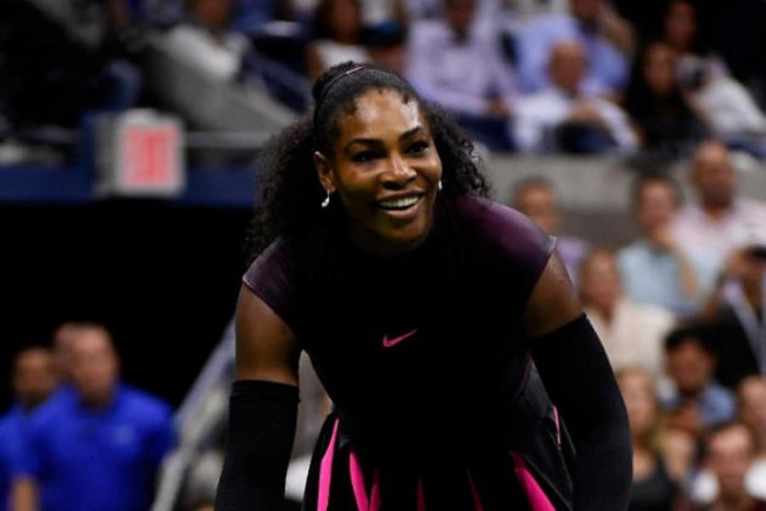 Serena Williams celebrates defeating Simona Halep (AFP Photo/Mike Hewitt)