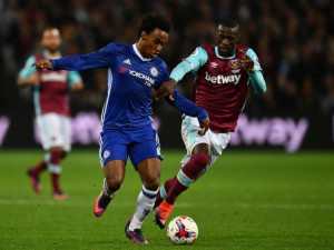 Willian and Diafra Sakho tussle for the ball (Getty)